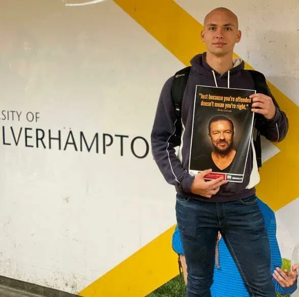 TPUK activist holding a Jordan Peterson quote poster at the University of Wolverhampton.